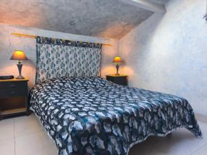 a bedroom with a large bed with two lamps at Mes maisons à la Pinède in Sainte-Maxime +48 photos