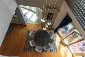 an overhead view of a dining room table and chairs at Villa Poljine GREEN in Sarajevo +37 photos
