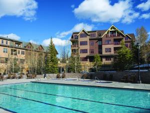 a swimming pool in front of some buildings at The Residences at Main Street Station by Hyatt Vacation Club in Breckenridge