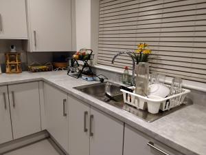 a kitchen counter top with a sink and a sink at HomeAway Comfort in Minster