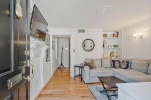 a living room with a couch and a table at Charming Rowhome in Downtown Annapolis in Annapolis