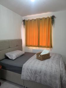a small bedroom with a bed and a window at HomeAway Comfort in Minster