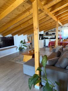 a living room with a couch and a table at Casa da Quinta in Estreito da Calheta