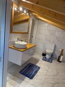 a bathroom with a sink and a toilet at Casa da Quinta in Estreito da Calheta +56 photos
