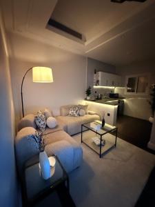 a living room with a couch and a table at Luxury apartment jeddah in alrawdah 6 Near the airport in Jeddah