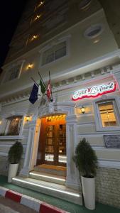 a restaurant with flags on the front of a building at Amirale in Oran