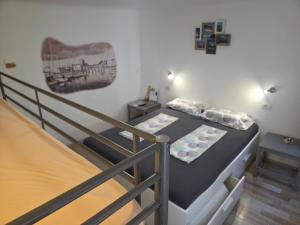 a room with two bunk beds and a staircase at Traditional Piran house in Piran