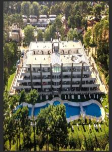 an aerial view of a large building with two swimming pools at Amarras pinamar in Pinamar