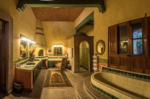 a large bathroom with a tub and a sink at Hacienda de los Santos in Álamos