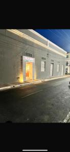 a large building with an open door on a street at Vila Mar Eco Hotel in Parnaíba