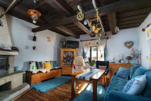 a living room with a couch and a table at Chalupa na Samote in Terchová