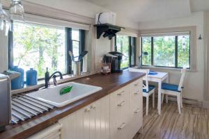 a kitchen with a sink and a counter top at Valhalla The Nest in Vesuvius