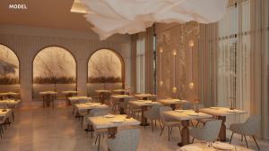 a restaurant with tables and chairs and a chandelier at Riu Palace Peninsula - All Inclusive in Cancún