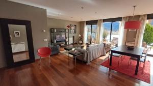 a living room with a couch and a table at Unique and special loft in Sant Joan de les Abadesses
