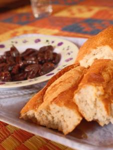 two slices of bread and a plate of beans at Auberge Tembahjit in Terjit