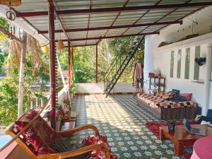 a living room with a couch and a table at Pepper Jazz Varkala in Varkala