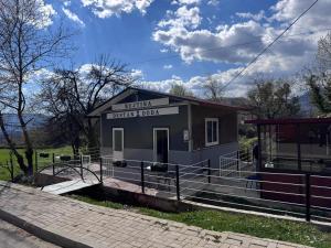 a small building with a sign that reads truthicity booth at Bujtina Destan Doda in Librazhd +8 photos