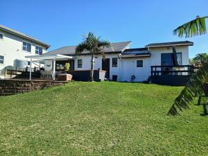 a house with a lawn in front of it at Turtle's Nest in Margate