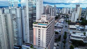 an aerial view of a city with tall buildings at FR1307B Estúdio alto padrão com cama king e garagem in Goiânia