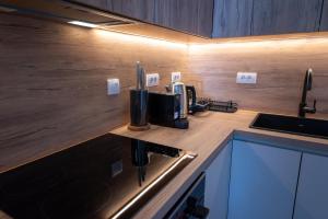a kitchen with a counter top with a coffee maker at SkyHill Jahorina Poljice Gondola in Jahorina