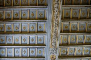 a room with a ceiling with gold and white at Palazzo Massimo Boutique Piazza Venezia in Rome