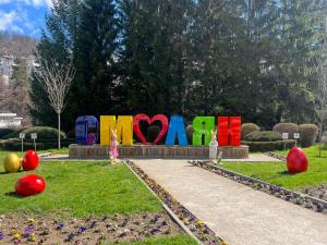 a park with a sign that says mom at Boutique Apartment Dolce Vita Free Parking in Smolyan