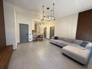 a living room with a couch and a dining room at Mountain sight Villa in Sheki