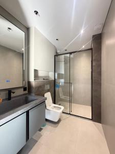 a bathroom with a toilet and a sink and a shower at Mountain sight Villa in Sheki +32 photos