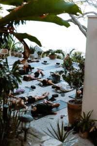 a group of people laying on the floor doing yoga at La Joya Sayulita in Sayulita +59 photos