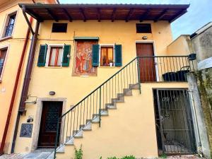 a building with stairs in front of it at Maison Lake Maggiore Art Stay,central Baveno, 60 mt from Lake and Hotel Dino Congress Center in Baveno
