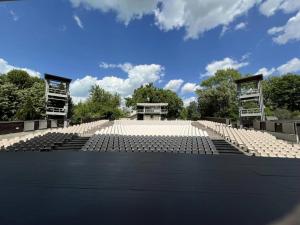 an empty amphitheater with a blue sky in the background at Fritz Holiday in Siófok