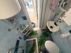 an overhead view of a bathroom with a sink and a toilet at Laniakea small apartment in the house in Risan in Risan +27 photos