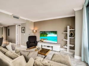 a living room with a couch and a tv at Luxury 3BR Water view 18th-Floor Deck Pool in Hallandale Beach +35 photos