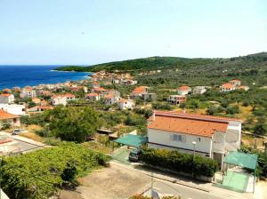 a view of a small town with the ocean at Apartments Boa in Slatine