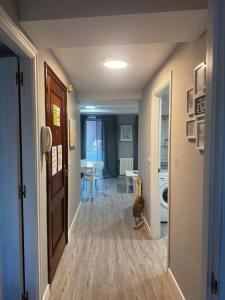 a hallway leading to a living room with a table at PASEO CASCO ANTIGUo in Lugo +70 photos