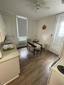 a kitchen with a table and chairs in a room at TORONTO UNIVERSITY PRIVATE ROOM-Next to Eaton Centre in Toronto