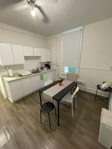 a kitchen with a table and chairs in a room at TORONTO UNIVERSITY PRIVATE ROOM-Next to Eaton Centre in Toronto +6 photos
