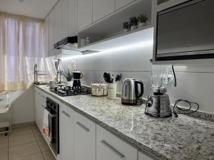 a kitchen with a counter top with a blender on it at Apartment in Lima JM in Lima