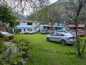 a group of cars parked in a yard at Condominio La Curva in Churín