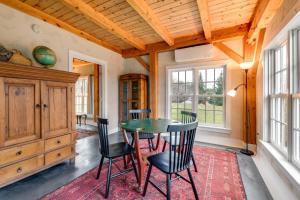a dining room with a table and chairs at Hike, Bike, & Explore: Vermont Family Farmhouse! in New Haven