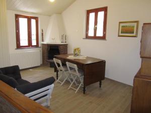 a living room with a desk and a fireplace at Casa Vacanze - B&B La Casetta in Mondolfo