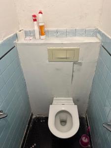 a small bathroom with a toilet in a stall at 15 min Paris in Drancy +15 photos