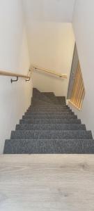 a staircase in a room with a stair case at Cottage in the middle of nowhere 2 in Ölfus +5 photos