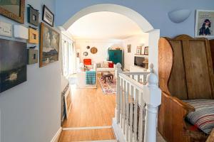 a room with a staircase and a living room at Woodlodge Retreat in Holywood