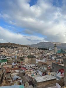 a view of a city with houses and buildings at Riad chak chak suite & spa in Fez