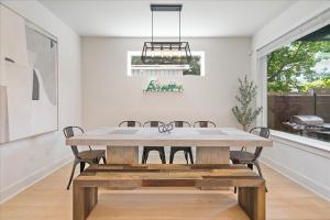 a dining room with a wooden table and chairs at Spacious 5BR Central Austin Home Sleeps 13 in Austin