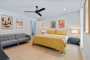 a bedroom with a large bed and a couch at Spacious 5BR Central Austin Home Sleeps 13 in Austin