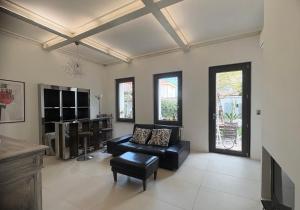 a living room with a couch and a tv at B&B Glicine in Civitanova Marche