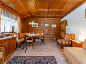 a dining room with a table and chairs at Madreit in Leogang +23 photos