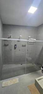 a shower with a glass door in a bathroom at Girassol & Estética in Macapá +11 photos